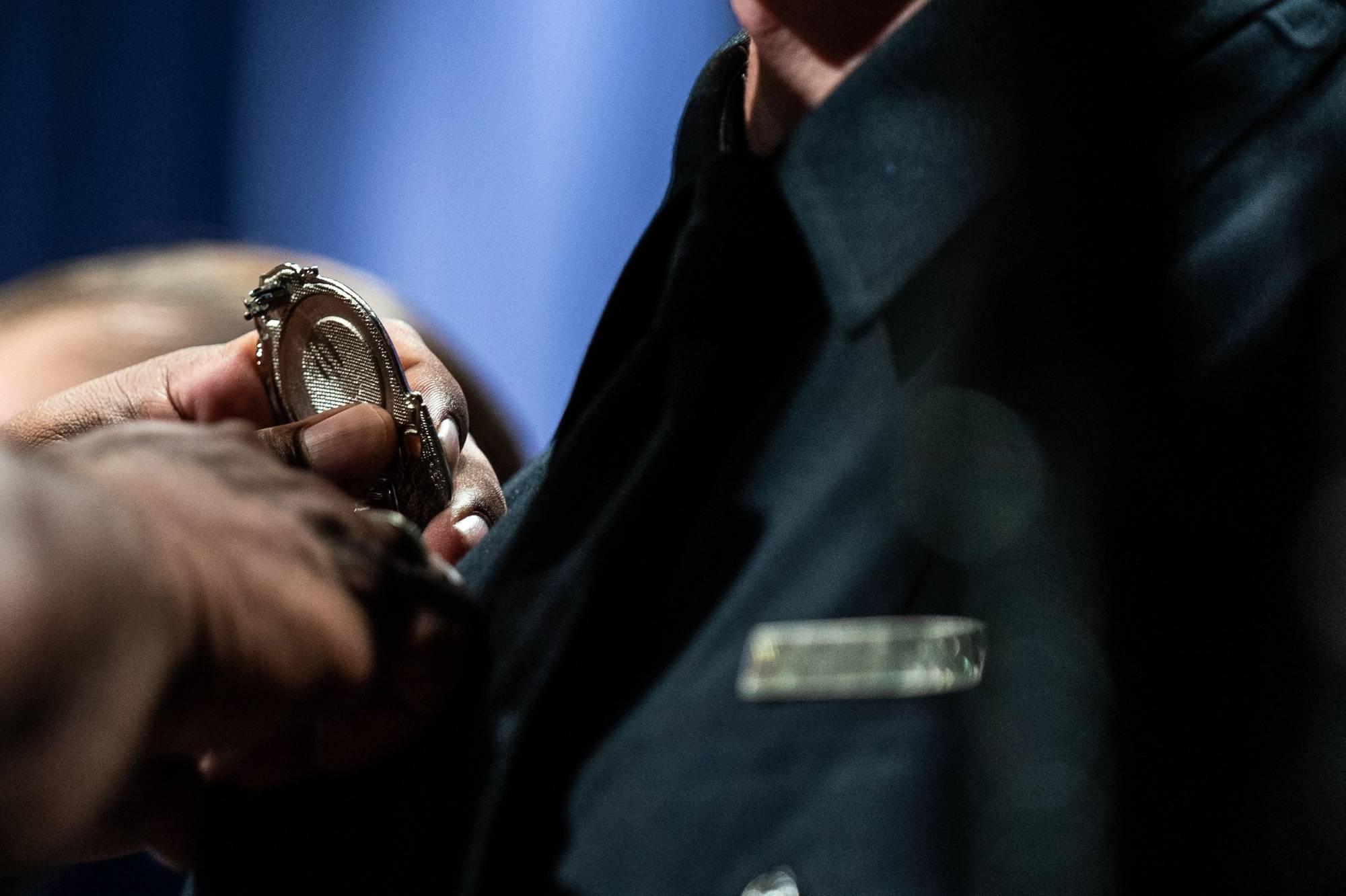 picture of badge being put on new officer. Click to see criminal justice minor